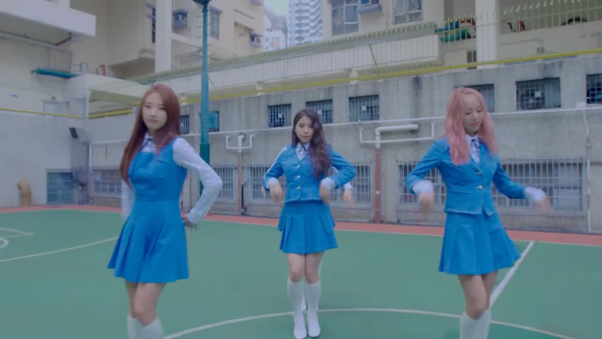 Loona One Third dancing on a basketball court.